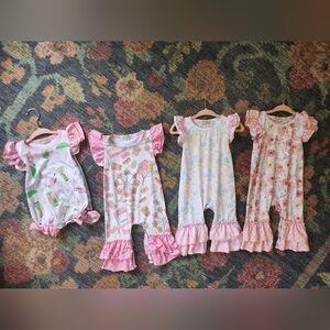 Set of Four Pink and White Baby Rompers